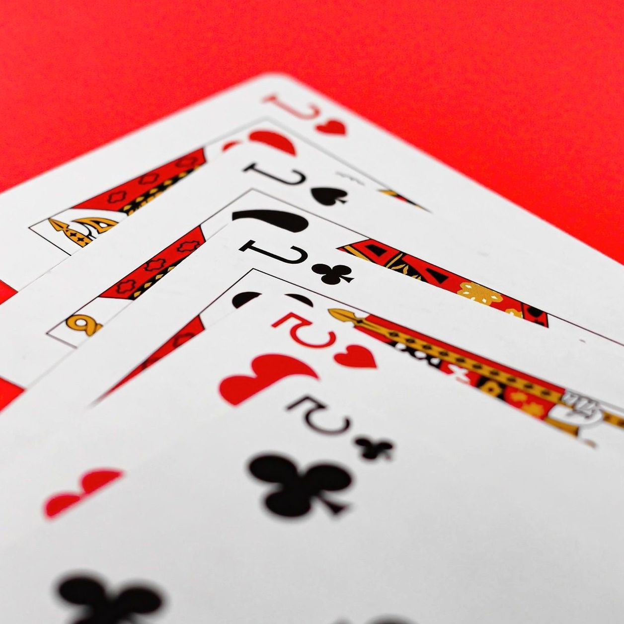 Four jacks on red felt