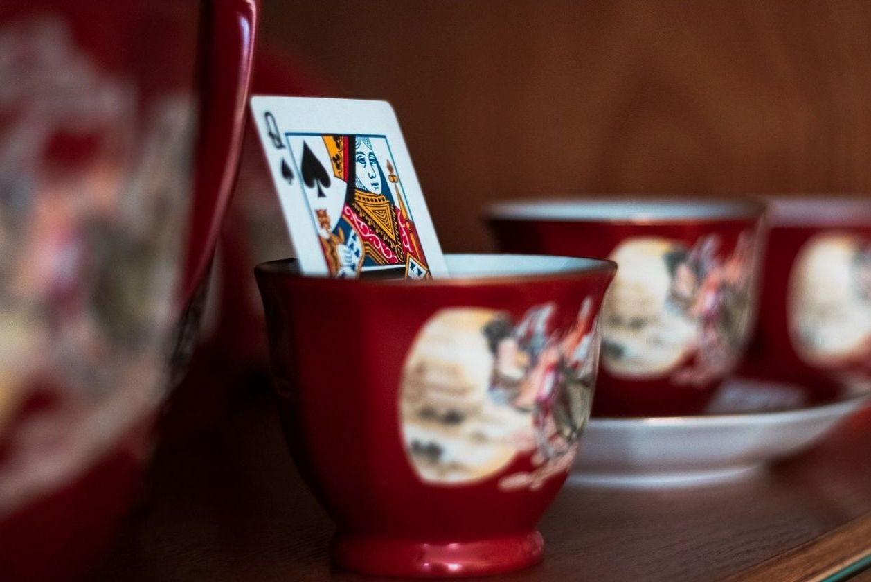 Styled table setting with a queen of spades